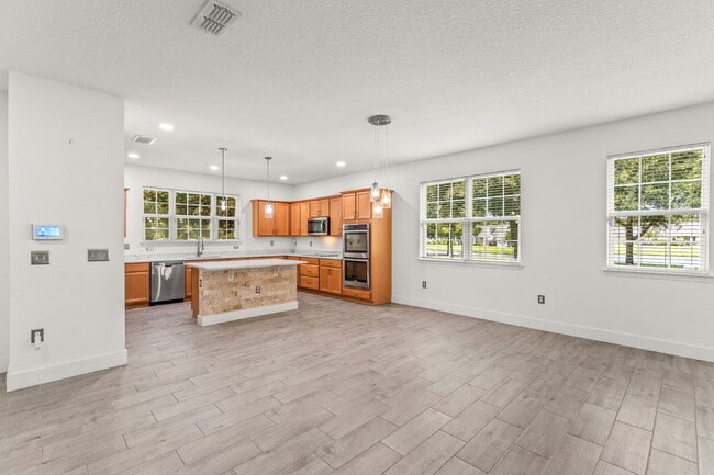 Spacious 3-Bed, 2.5 Bath End Unit Townhome in Windermere with 2 Car Garage!
