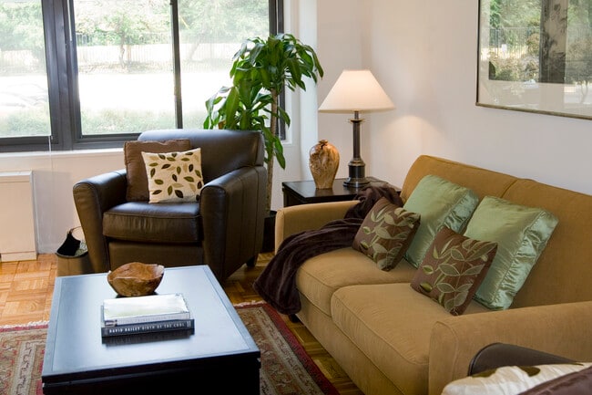 Living area with parquet flooring - eaves Glover Park