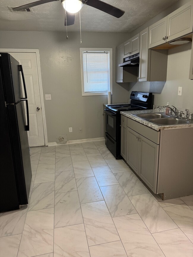 Kitchen with W/D Hookups - 6486 Raymond Dr Unit Flat Duplex