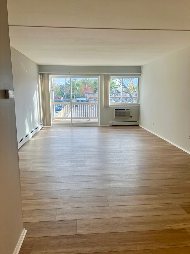 2BR, 1BA - 1,025SF - Living Room - Camelot Apartments
