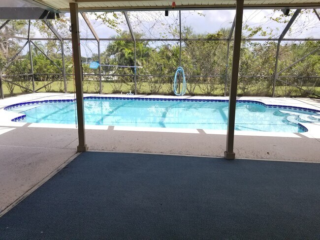 Photo - 3/2/1 with screened in patio/pool