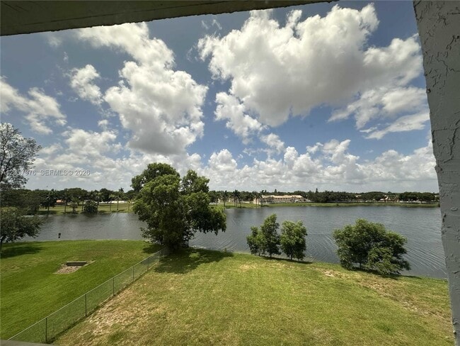 Building Photo - 8560 N Sherman Cir Unit 401