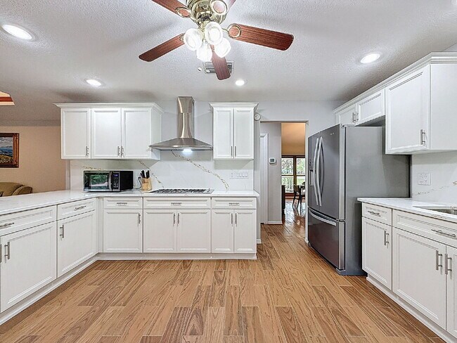"Spacious 4-Bedroom Oasis in Tarpon Springs – 3,259 Sq Ft of Comfort and Style!"