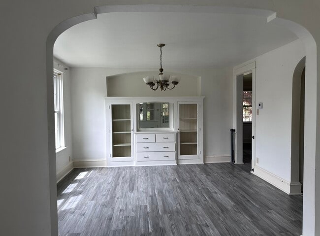 From the living room, walk into the dining room that connects to the kitchen - 2712 S 9th St