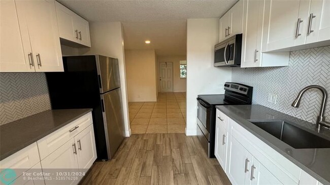 Photo - 850 E Commercial Blvd Condo Unit 237E