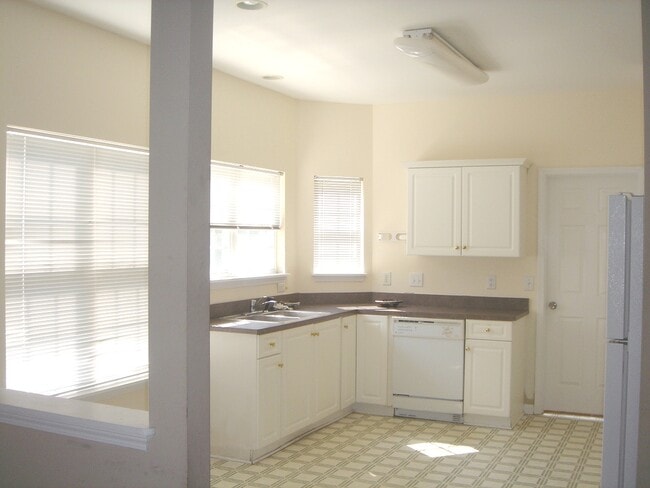 Photo - Student friendly! Large 5 BR, near WB and UNCW fireplace, 2 car garage , deck