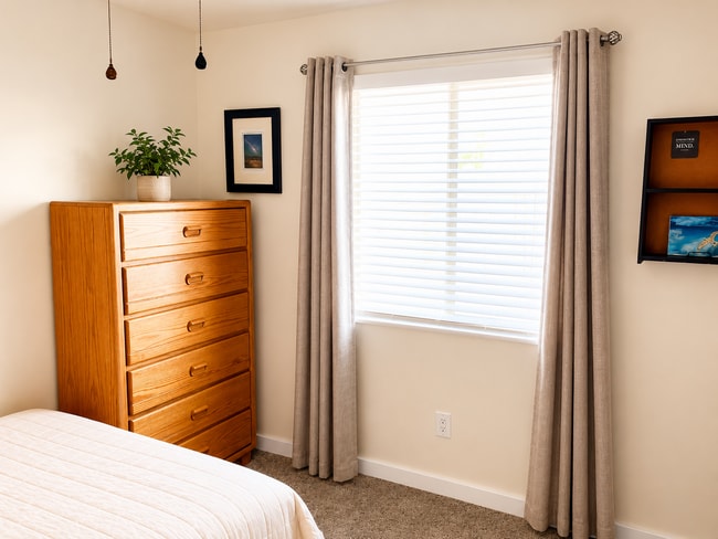 Dresser, Room darkening blinds & curtains, ceiling fan, foldable desk inside closet, and hamper - 8941 E 24th Ln