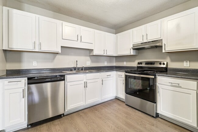 Prepare meals in style with white cabinets and quality stainless steel appliances, professionally operated by Highlands Vista Group.