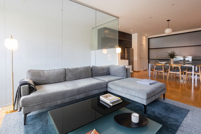 Abundant light with floor to ceiling windows and glass walls. - 2250 11th St NW Unit 103