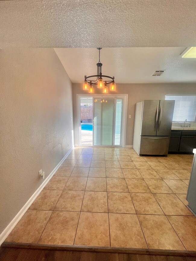 Photo - Charming 3-bed 2-bath home with a pool & pool service included!