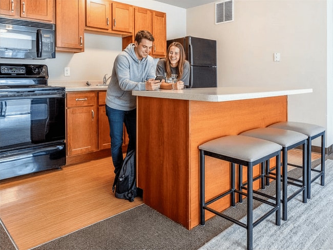 Modern kitchen featuring breakfast bar