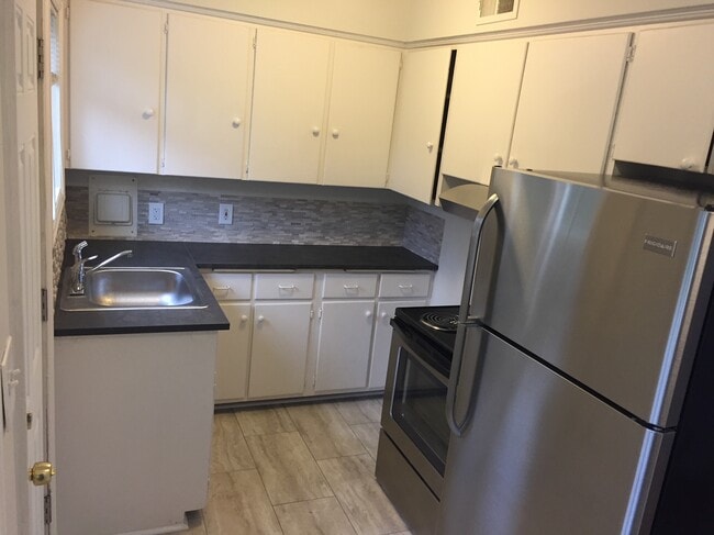 New remodeled kitchen with new counter tops, back splash , tile floor and stainless appliances - 7222 East Burnside Unit Apt #3