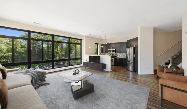 Spacious living rooms with wood flooring
