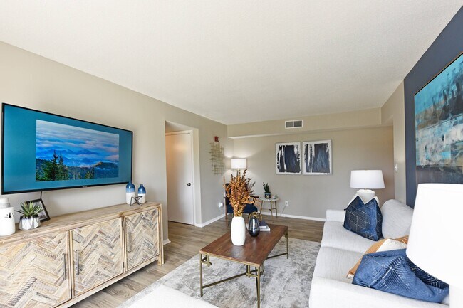 Spacious living room with hardwood-style flooring