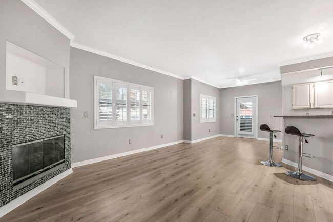 Photo - Light-Filled Dual-Suite Condo with Soaring Ceilings, Fireplace & Private Balcony in Amenity-Rich ...