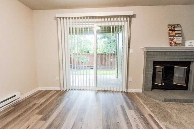 Puyallup Apartments - Cambridge on Seventh Apartments - Dining Room, Deck, and Fireplace - Cambridge on Seventh
