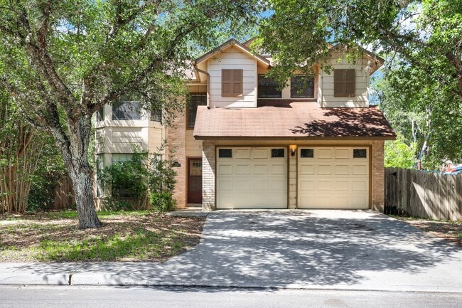 Building Photo - ***APPLICATION CURRENTLY UNDER REVIEW***Spacious Two-Story with Soaring Ceilings & No Carpet