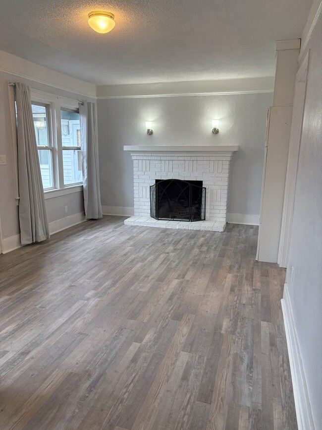 living room with wood burning fireplace - 445 16th St SE Apartments Unit 445 16th STSE