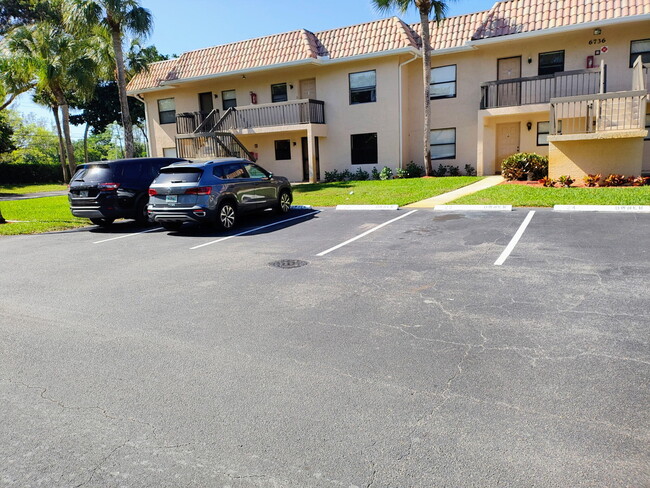 Building Photo - 6736 Palmetto Cir S Unit 102