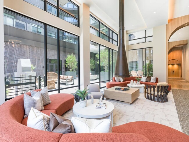 Stylish indoor and outdoor lounge spaces offer cozy spots to relax, complete with modern seating and warm natural light.