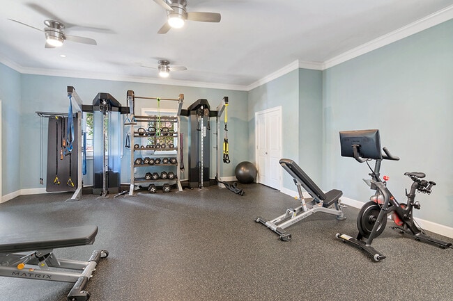24-hour fitness center with spin bikes and virtual trainer