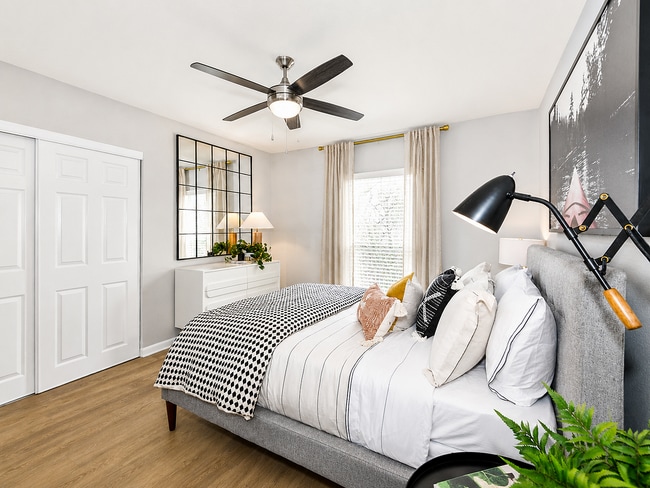 Spacious bedrooms with wood floors, large closets, and natural light throughout.