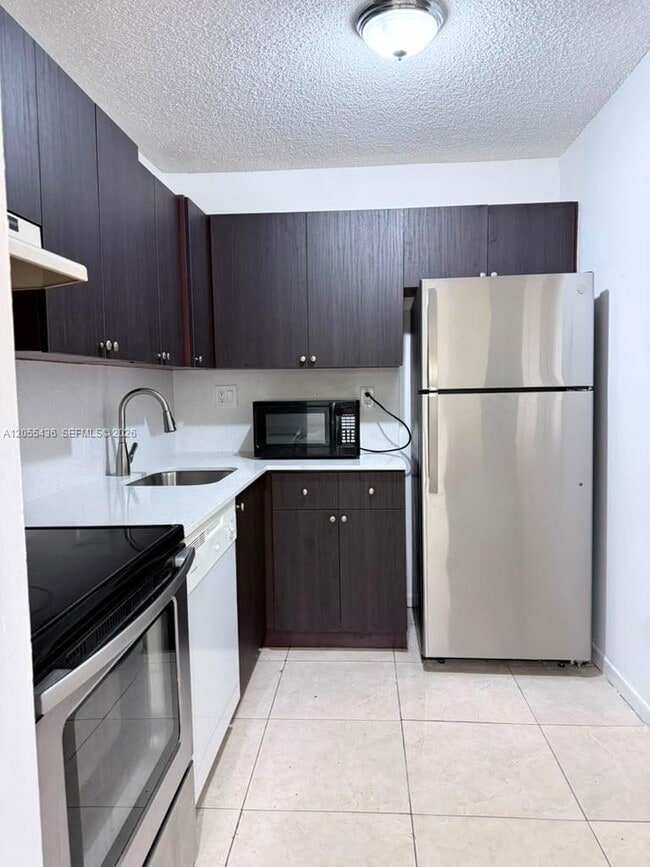 Building Photo - 7090 NW 179th St Unit 107