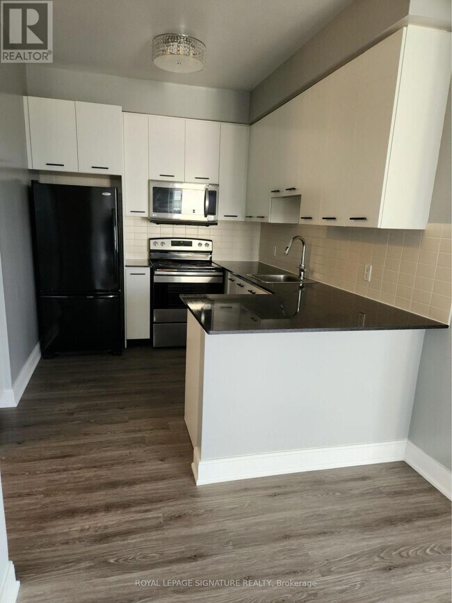 Photo - 135 Village Green Square Unit 623
