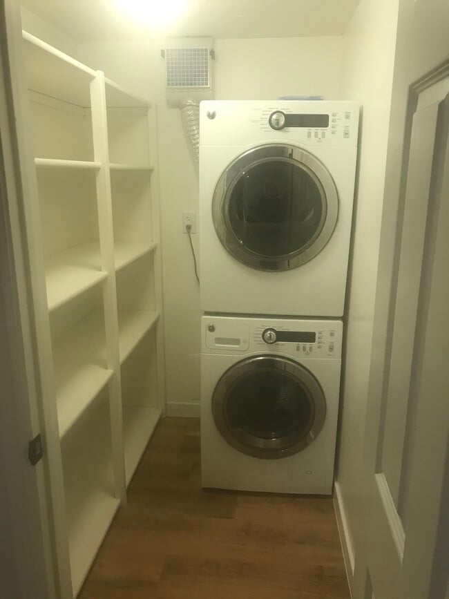 Laundry room with additional shelving for pantry or storage. - 587 HILLSIDE DR Unit Basement