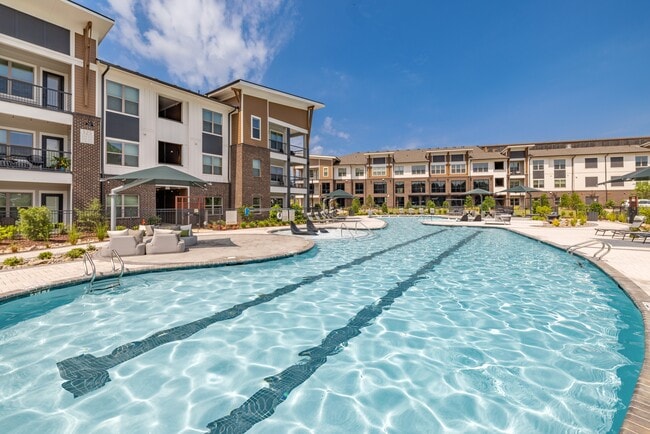 Salt-Water Pool - Resort-style pool with sun shelf, cabanas and grills for relaxing and entertaining close to home.