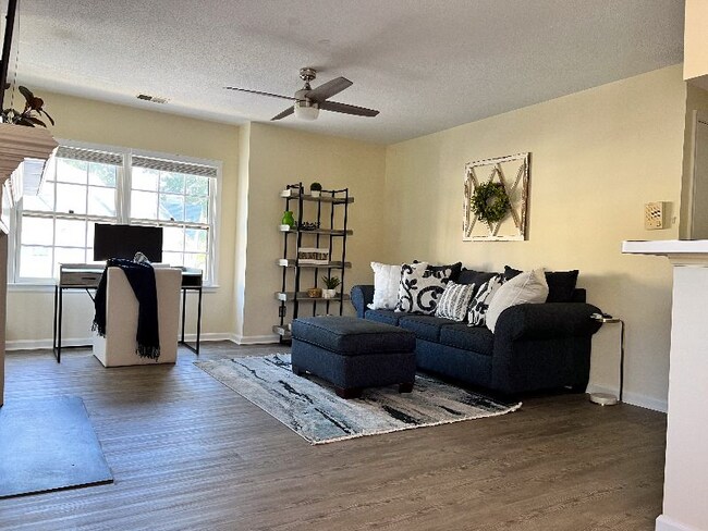 Living room view from dining area. - 704 Rapidan River Ct Unit E