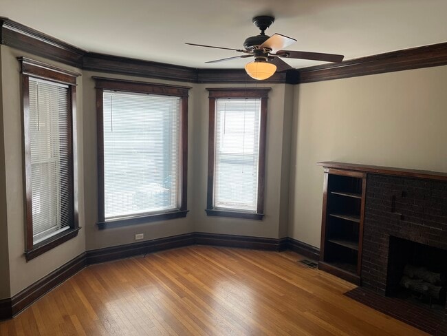 Bay windows at living area - 6110 S Evans Ave Apartments Unit 1