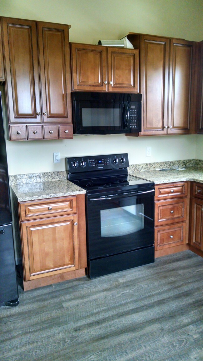 Granite countertops and High end cabinetry - 1 E. Main St. Unidad Back apt