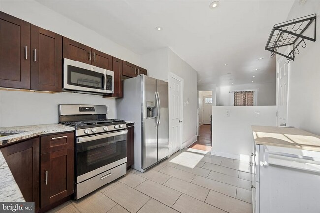 Photo - Modern 3-Bedroom Rowhome with Backyard Pat...