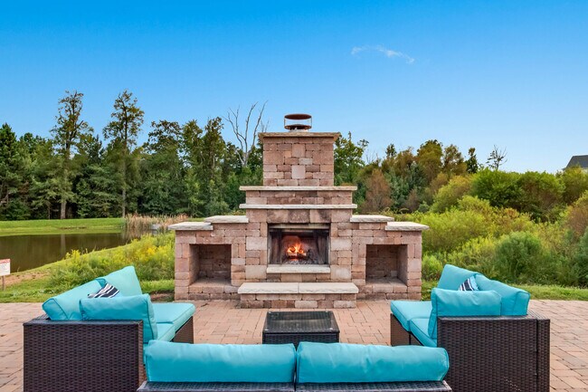 Lakeside fireplace with couch seating