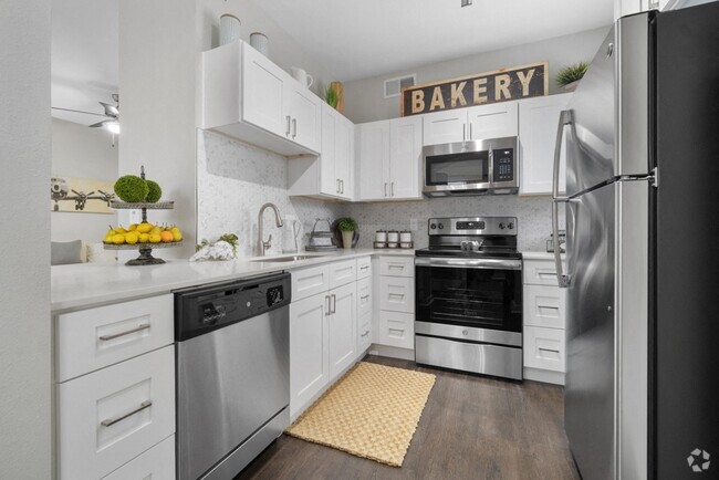 Platinum White Scheme - Newly Renovated Kitchens with GE Stainless Steel Appliances, Custom Cabinetry with Soft-Close Doors and Drawers, and White Marble or Grey Quartz Countertops - Flatiron District at Austin Ranch Rental