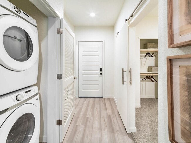 In-home laundry and a spacious closet at Modera University Park, thoughtfully designed to streamline daily routines and storage needs.