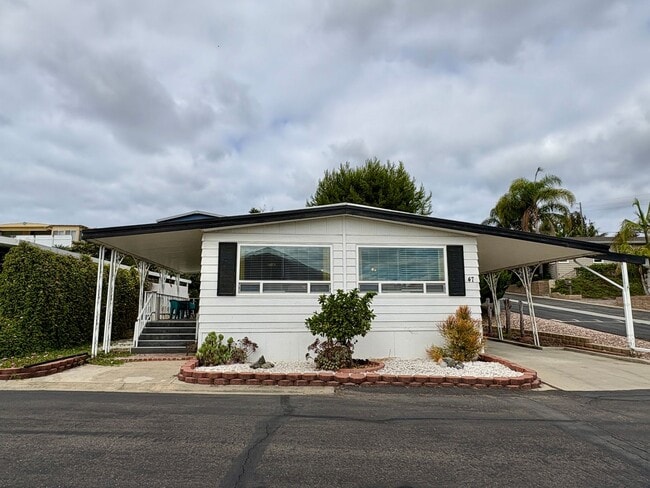 Building Photo - Welcome to the vibrant 55+ mobile home com...