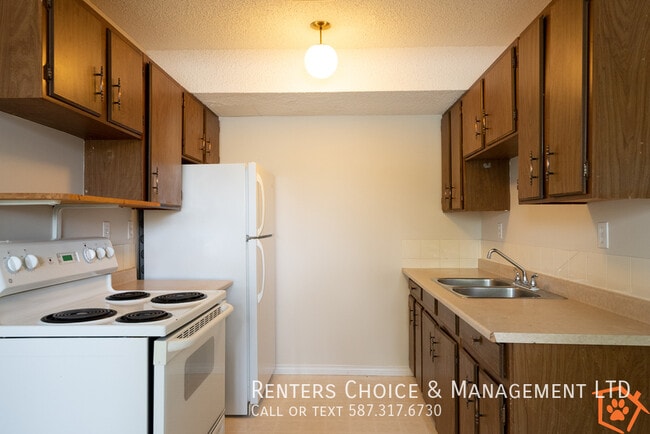 Photo - Townhouse featuring Extra Storage, Assigned Parking & Condo Amenities