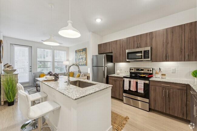 Enjoy cooking and entertaining around our spacious, modern kitchen islands at Latitude Apartments - Latitude Rental