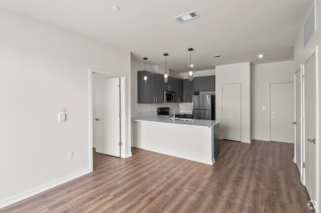 Building Photo - The Flats at Carriage Commons Rental