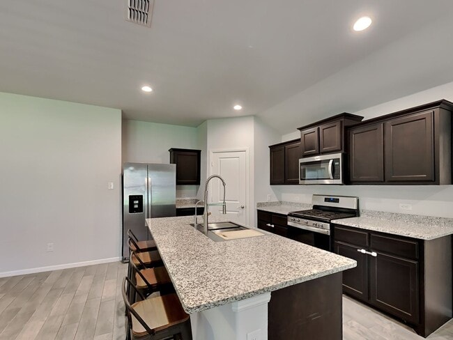 Photo - Chapel Creek Beauty with Designer Kitchen, Spacious Layout & Private Backyard Retreat!