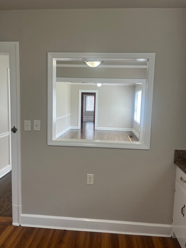 View from kitchen into dining room and living room - 1402 N Tennessee Blvd