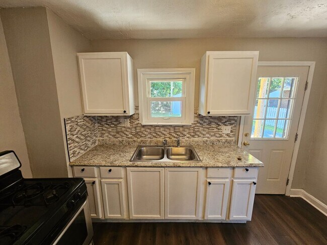 Photo - Spacious 4-Bedroom Cleveland Home with Updated Flooring & 2-Car Garage