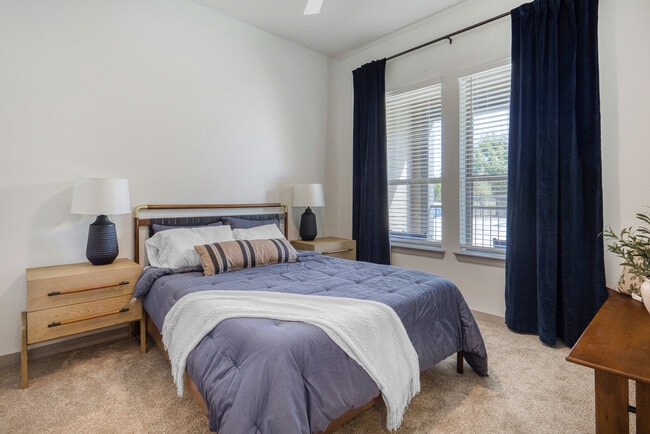 Spacious bedroom with abundant natural light at Mesquite Trails at Brooks