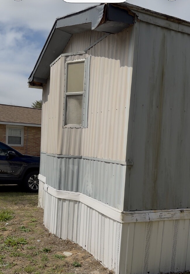 Photo - Handyman Special – Land + Home (Rent-to-Own)