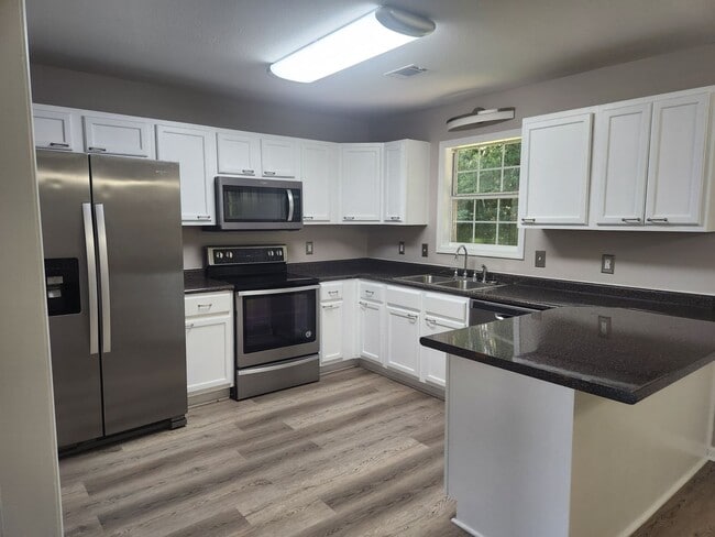 Photo - Spacious 3-Bed, 2-Bath Home in a Quiet Neighborhood