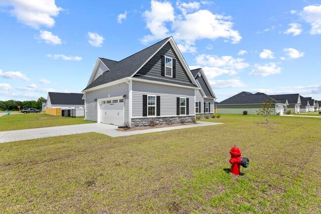 Photo - Like-New 4BR Home in Stateside with Pool Access & Side-Load Garage