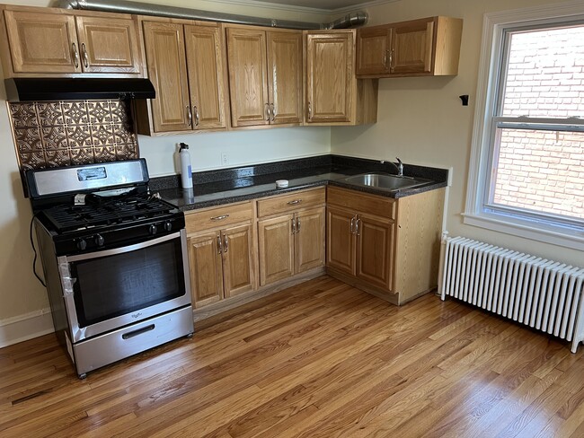 Large eat in kitchen with new appliances - 154 Grand St Apartments Unit 3