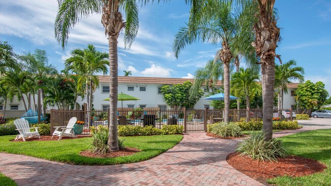 Experience the serenity of our lush tropical community, where everyday living becomes a tranquil escape. - Boca Winds Apartments